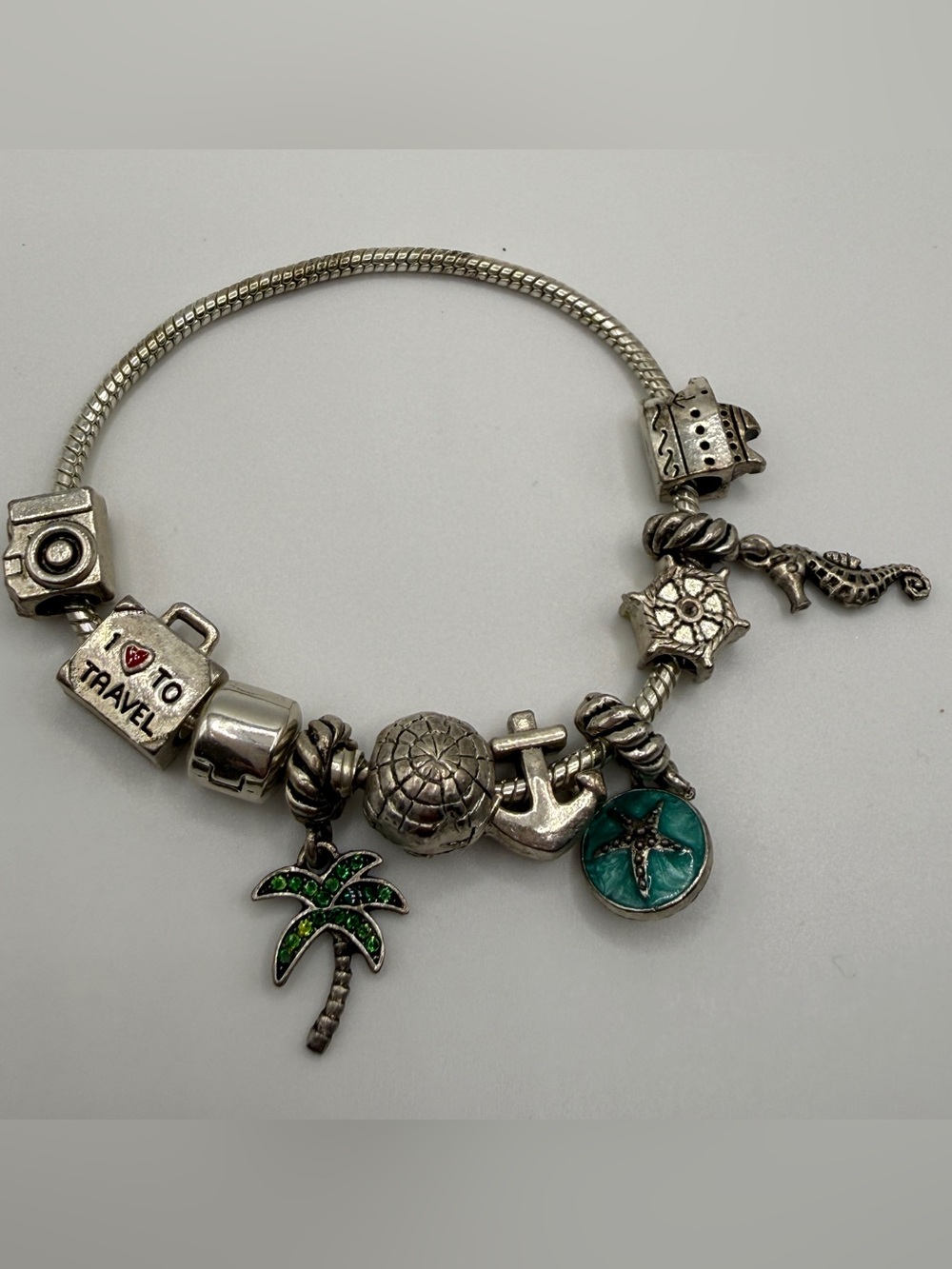 Silver Travel Charm Bracelet with Green and Teal Accents